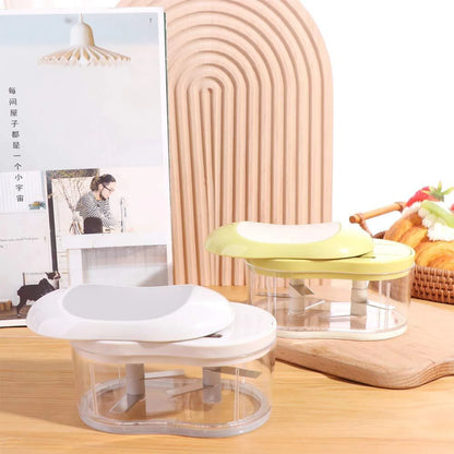 Hand-push garlic prep tool shown from alternate angle